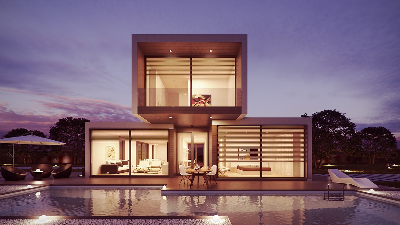 Contemporary luxury residence with warm interior lighting at dusk